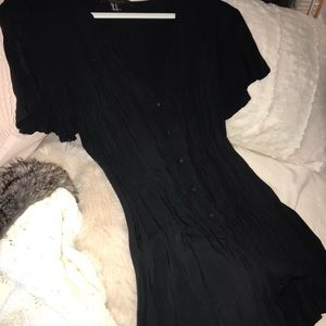 Black romper with ruffle bottom